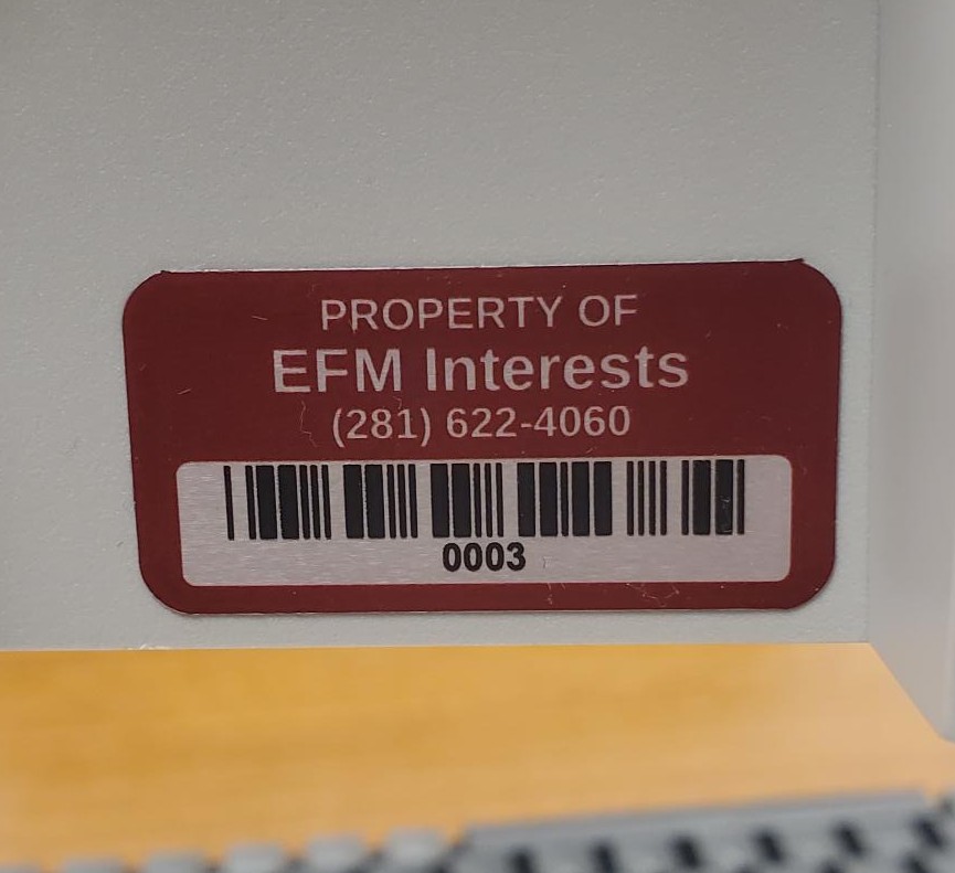 Red sticker reading Property of EFM Interests, with a barcode and the number 0003 below it